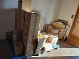 many boxes stacked on top of each other in a room
