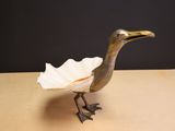 a small bird that is sitting on a table