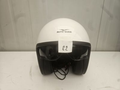 a white helmet with a tag on it on a table