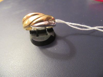a gold ring with a shell on top of it