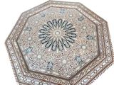 an image of a white and brown octagonal table with a pattern on it