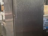 a large stainless steel refrigerator in the middle of a kitchen