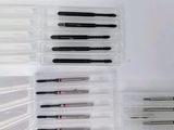 a lot of pens in a plastic case on a table