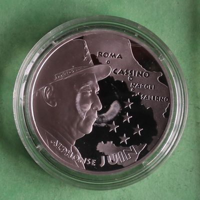 a close up of a coin with a picture of a man in a hat on it