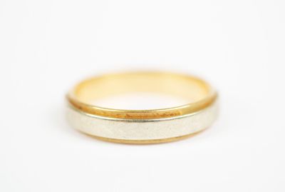 an image of a gold wedding ring on a white background