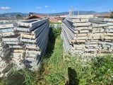 a large pile of bricks sitting in the grass