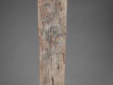 a close up of a piece of wood with carvings on it