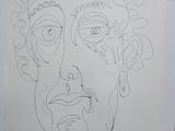 a drawing of a man ' s face on a piece of paper