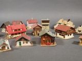 a lot of small model houses that are on a table