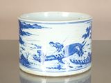 a blue and white cup sitting on a table