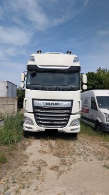 two trucks parked next to each other on the side of the road