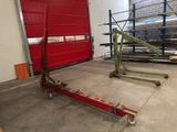 an image of a warehouse with a red garage door