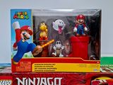 a box with a bunch of action figures on it