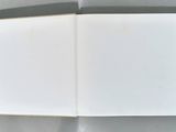 an open book with a picture of a cat on top of it