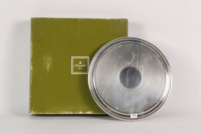 a box with a silver object in it and a box with a green box