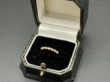 a small black box with a ring inside of it