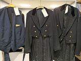 three jackets that are hanging on a rack in a store