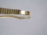 a gold bracelet that has a clasp on it