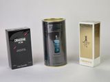 three different types of men ' s perfumes on a white surface