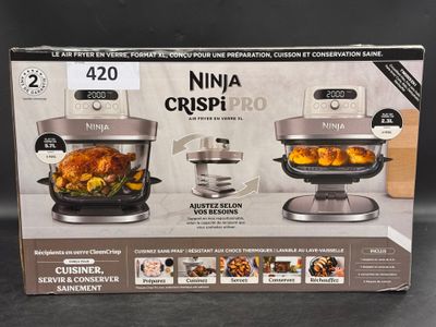 boxed box of ninja crispi pro with chicken and vegetables in it