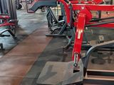 a gym area with machines and other equipment on display