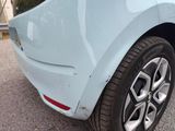 a close up of a car ' s rear end with a cat on it