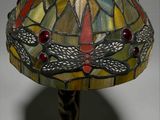 an image of a table lamp with a dragonfly design on it