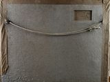 a picture of a piece of metal with a rope on it