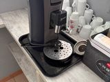 a coffee maker sitting on a counter in a kitchen