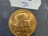 a close up of a gold coin with a label on it