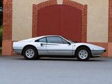 a white sports car parked in front of a brick building