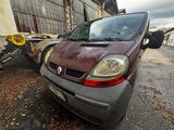 a small car that is parked on the side of the road