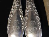 two spoons that are sitting on a table