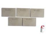 four business cards with the names of three different companies on them