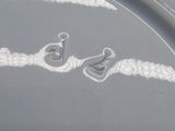 a close up of a plate with a rope on it