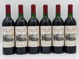 six bottles of red wine are lined up in a row