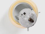 a light that is on in a room with a white wall