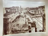 an old picture of a view of a city from the top of a building