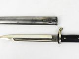 two knives are laying side by side on a white surface