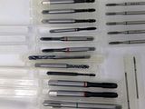 a lot of pens that are sitting on a table