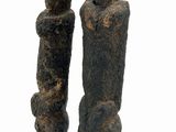 statue of two people standing on a black base