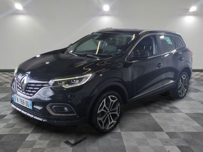 a black renault kad suv parked on a checkered floor
