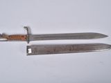 pair of two knives on a white surface with a white background