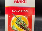 an image of a box of atari ' s galaxyan on a table