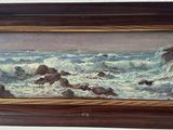 painting of a painting of waves crashing on rocks in a wooden frame