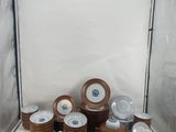 many plates and cups sitting on a table in a box
