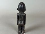 a small figurine of a man standing on a table