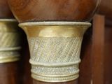a close up of a wooden pole with a number on it