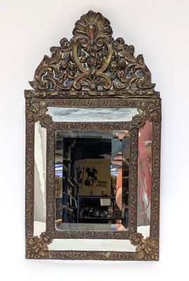 a mirror hanging on the wall in a room