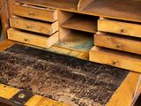 a wooden desk with drawers and drawers on top of it